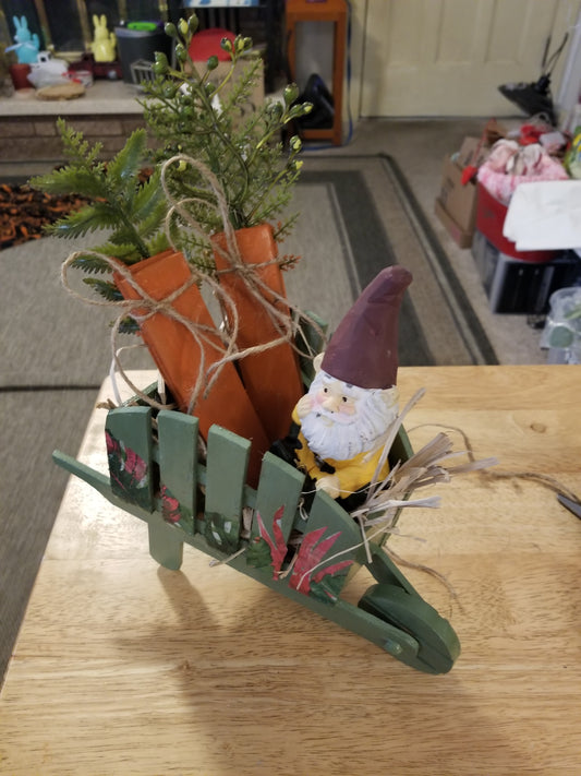Wooden wheelbarrow with gnome