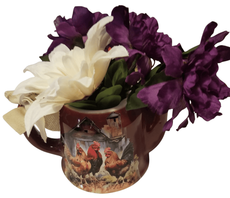 Ceramic tea pot with flowers - The Creative Shed - Decor - The Creative Shed - A ceramic tea pot with a floral pattern, displaying a transfer print design of chickens and flowers, filled with artificial flowers. - 