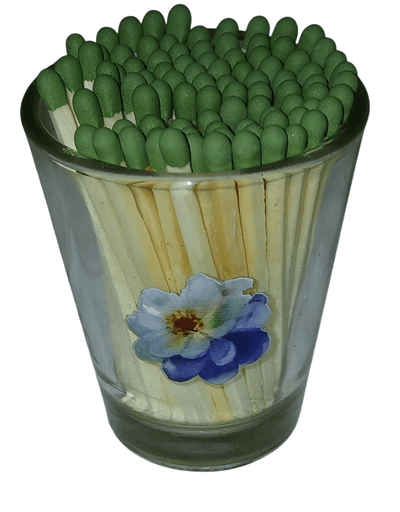 Clear shot glass with matches - The Creative Shed - The Creative Shed - Glass container filled with green matches on a white background - 