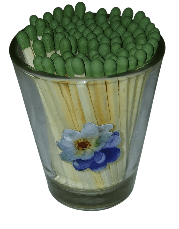 Clear shot glass with matches - The Creative Shed - The Creative Shed - Glass container filled with green matches on a white background - 
