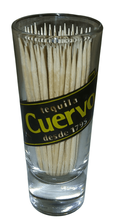 Cuervo shot glass with toothpicks - The Creative Shed - The Creative Shed - Glass filled with toothpicks labeled 'tequila Cuervo' on a white background - 