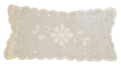 Embroidered floral furniture scarf - The Creative Shed - The Creative Shed - A white linen furniture scarf with embroidered floral patterns and stitching around the edges. - 