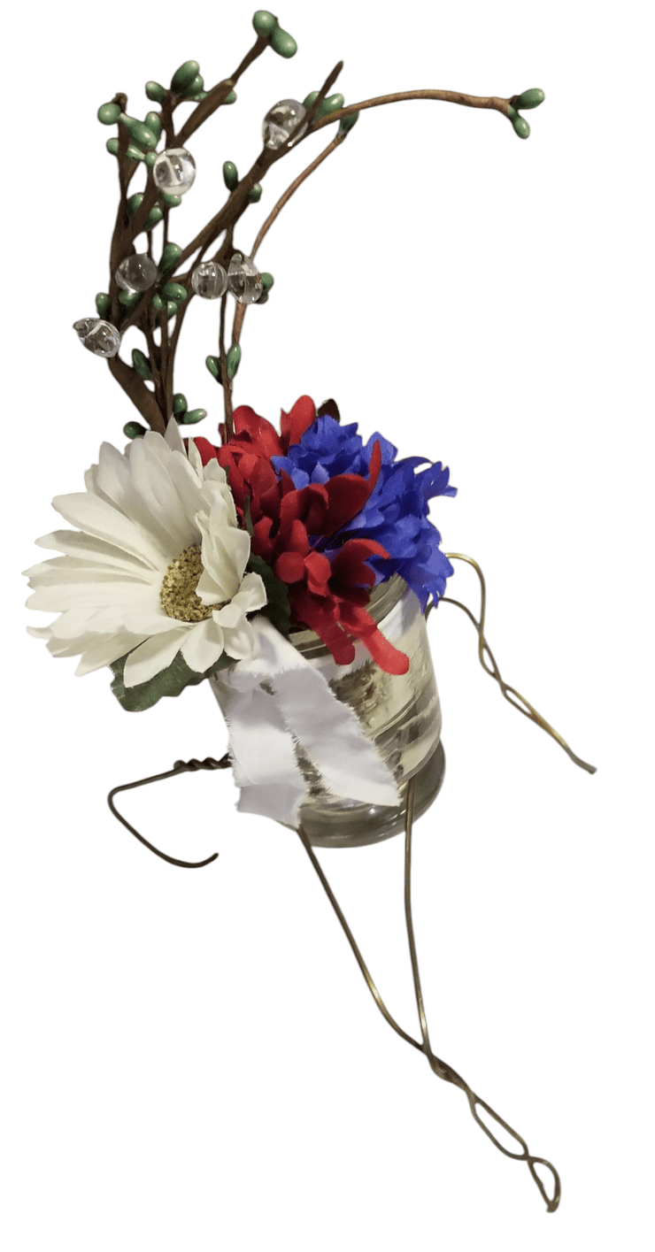 Glass Insulator floral - The Creative Shed - The Creative Shed - A floral glass insulator vase with a wire stand, decorated with artificial flowers in red, white, and blue. - 