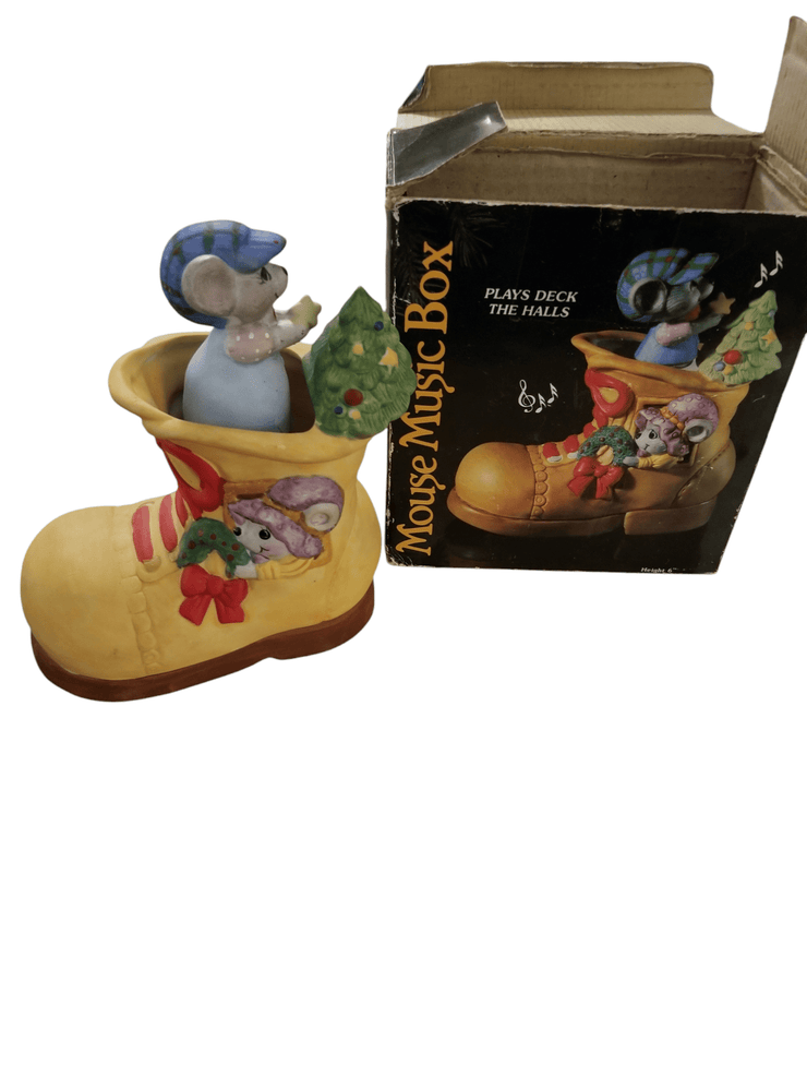 Jasco mouse music decor - The Creative Shed - The Creative Shed - A ceramic music box in the shape of a mouse sitting inside a boot, with Christmas decorations, alongside its packaging box. - 