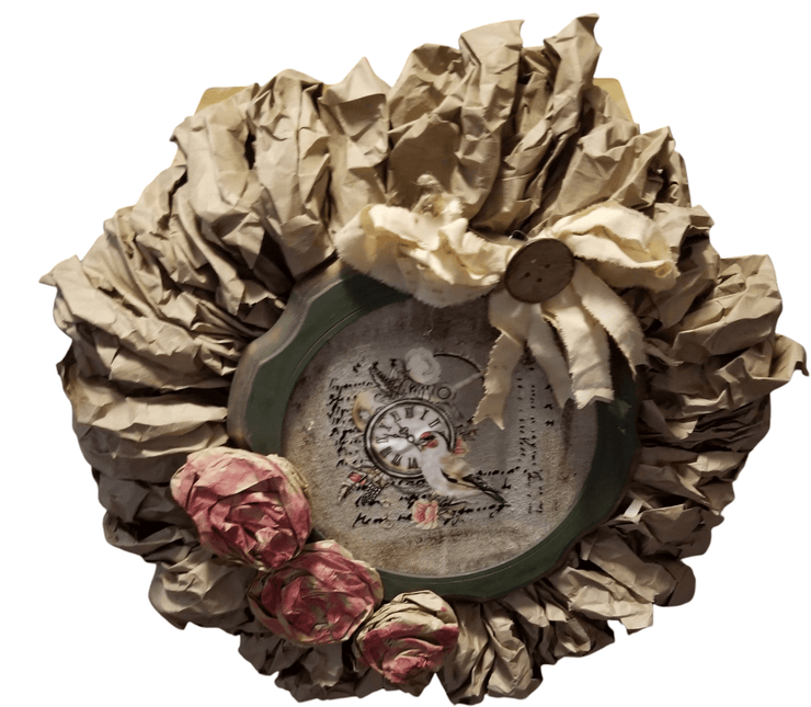 Paper wreath decor - The Creative Shed - The Creative Shed - A paper wreath decoration with beige and pink elements, featuring a central circular design with a pattern. - 