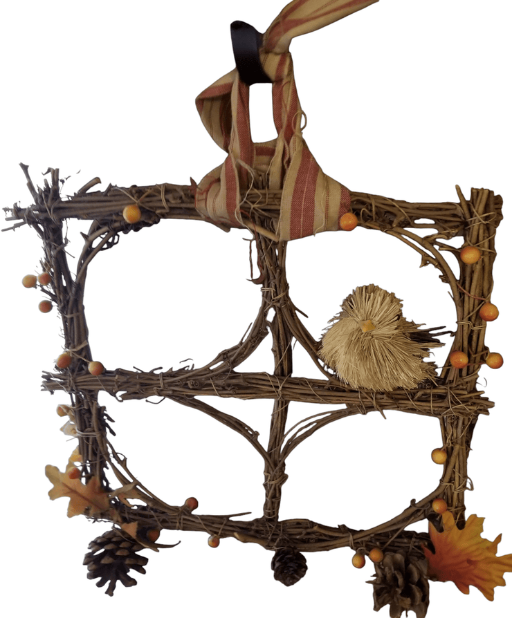 Square twig wall decor - The Creative Shed - The Creative Shed - A square - shaped wall decor made of twigs and branches, featuring a birdhouse in the center, surrounded by artificial leaves and berries. - 