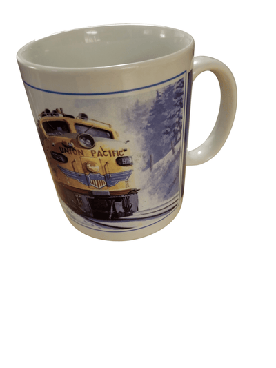 Union Pacific mug - The Creative Shed - The Creative Shed - A ceramic mug with a printed image of a Union Pacific train on a snowy landscape. - 