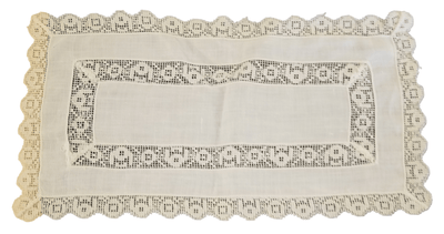 Vintage linen table decor - The Creative Shed - The Creative Shed - A vintage linen tablecloth with embroidered edges and a furniture scarf, primarily in a neutral color. - 