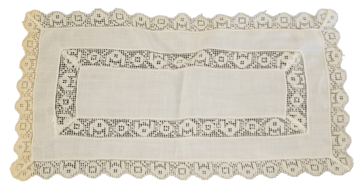 Vintage linen table decor - The Creative Shed - The Creative Shed - A vintage linen tablecloth with embroidered edges and a furniture scarf, primarily in a neutral color. - 