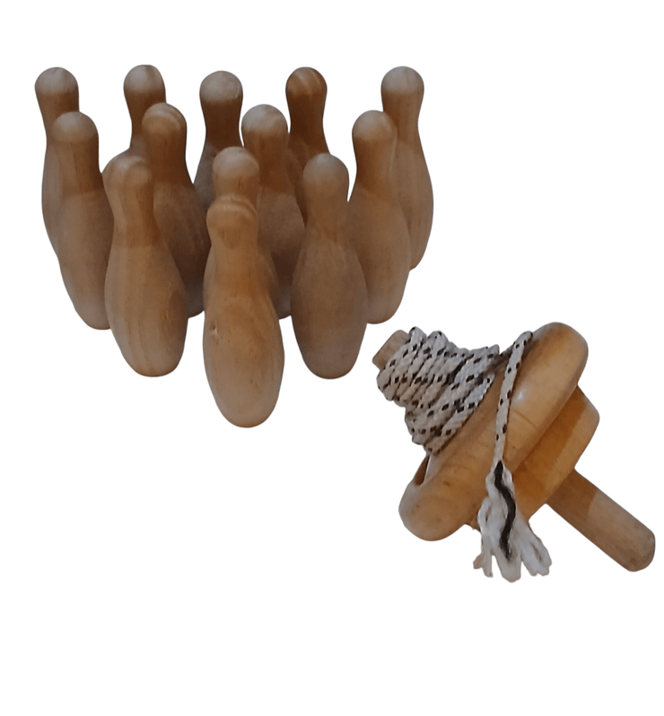 Wooden top n pin game - The Creative Shed - The Creative Shed - Set of wooden bowling pins with a wooden ball on a white background - 